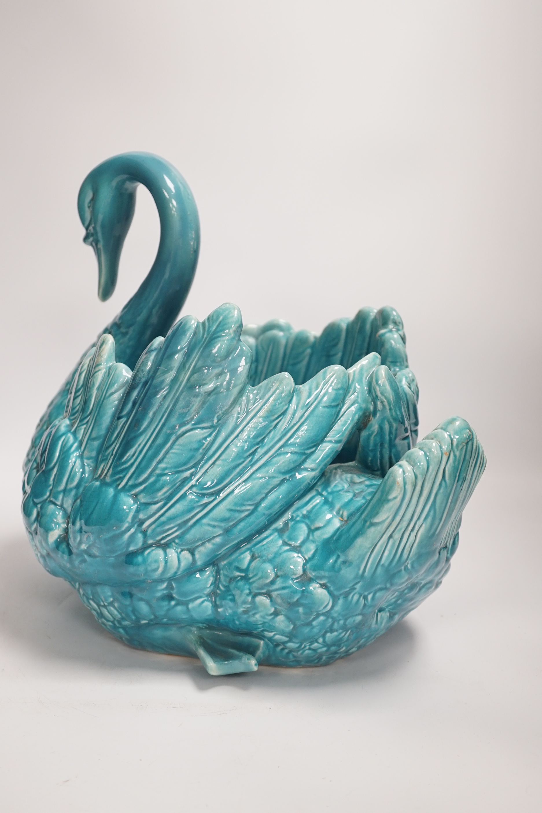 A large turquoise majolica swan, 31.5cm